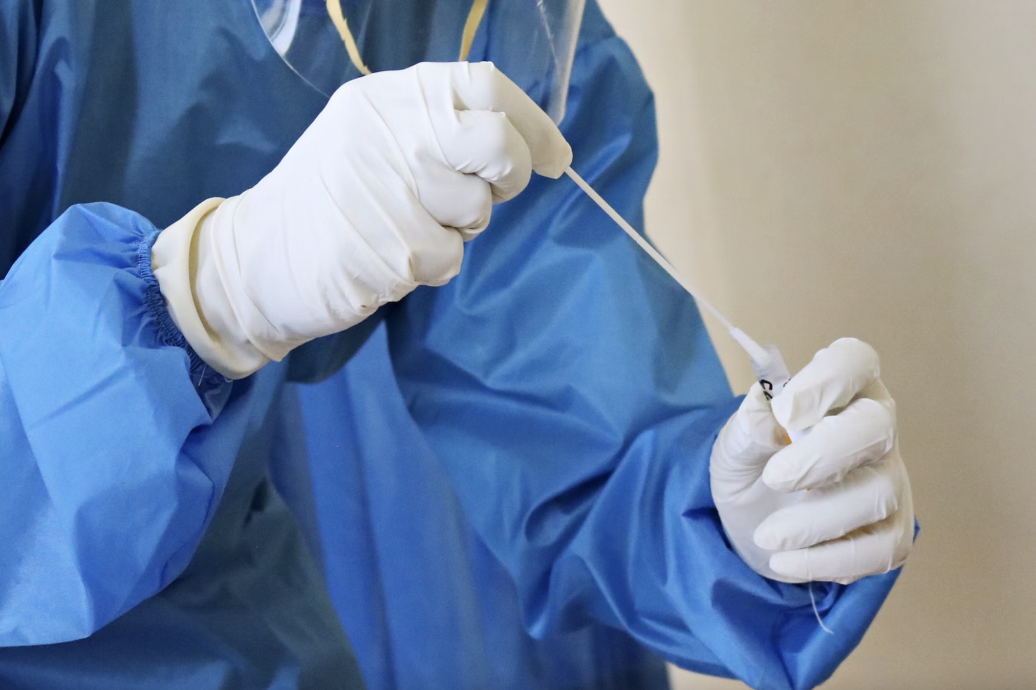 CDC scientist reviewing a plate with serological test samples. ARPA-H is in part inspired by the COVID-19 pandemic.